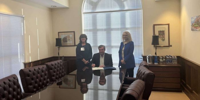 a man and a woman sitting on a table
