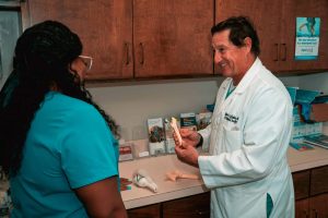 a man standing in a kitchen preparing food