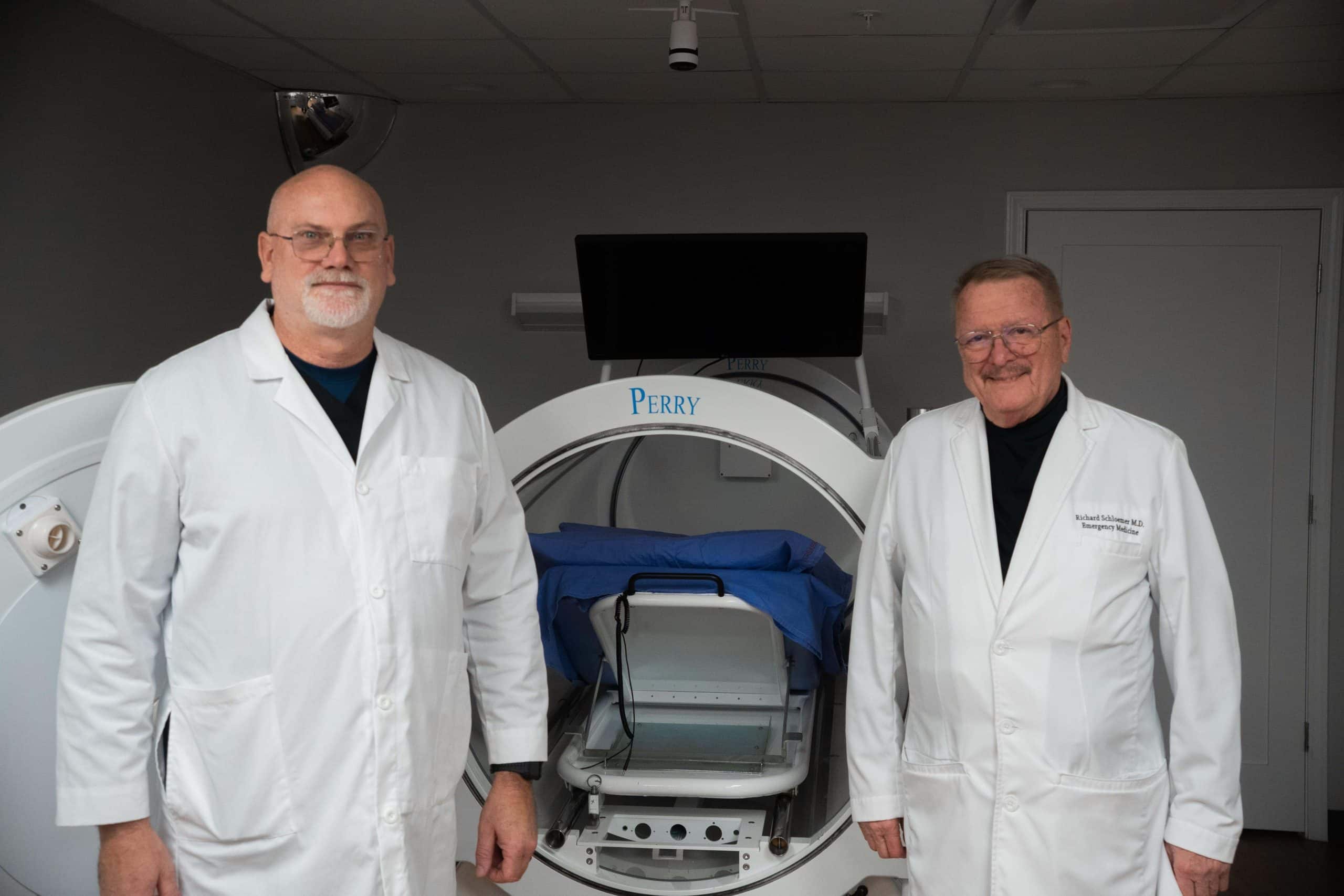 a man standing in front of a group of people posing for the camera