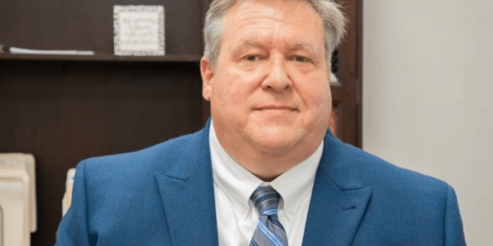 a man wearing a suit and tie